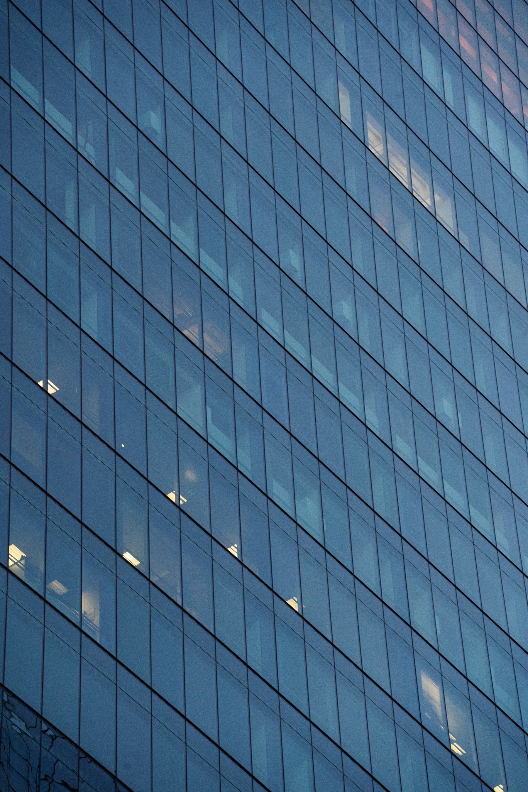 Glass facade of a modern corporate office building
